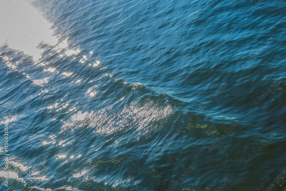 Fototapeta premium sea wave close up. The glare of the sun on the sea surface