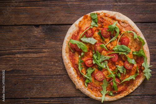 Italian pizza with tomatoes and rucola #115083002