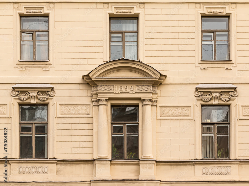 Several windows in a row on facade of the Saint-Petersburg University of Economics front view.