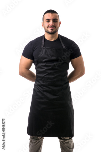 Fototapeta Portrait of handsome chef in black apron