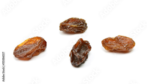 Closeup of black raisins on white (dried fruits)