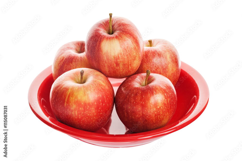 Red apple on plate. Isolated on white background Red apple on plate. Isolated on white background