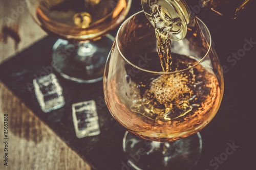 Φωτογραφία Pouring cognac in a glass