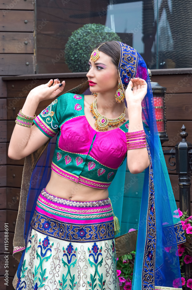 Beautiful young indian woman in traditional clothing Stock Photo ...