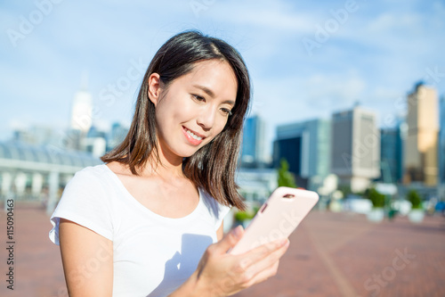 Woman use of mobile phone at Hong Kong city photo