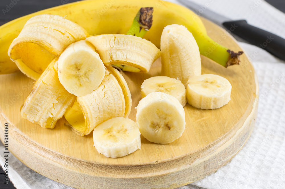 Fresh bananas sliced on white textile Fresh bananas sliced on white textile