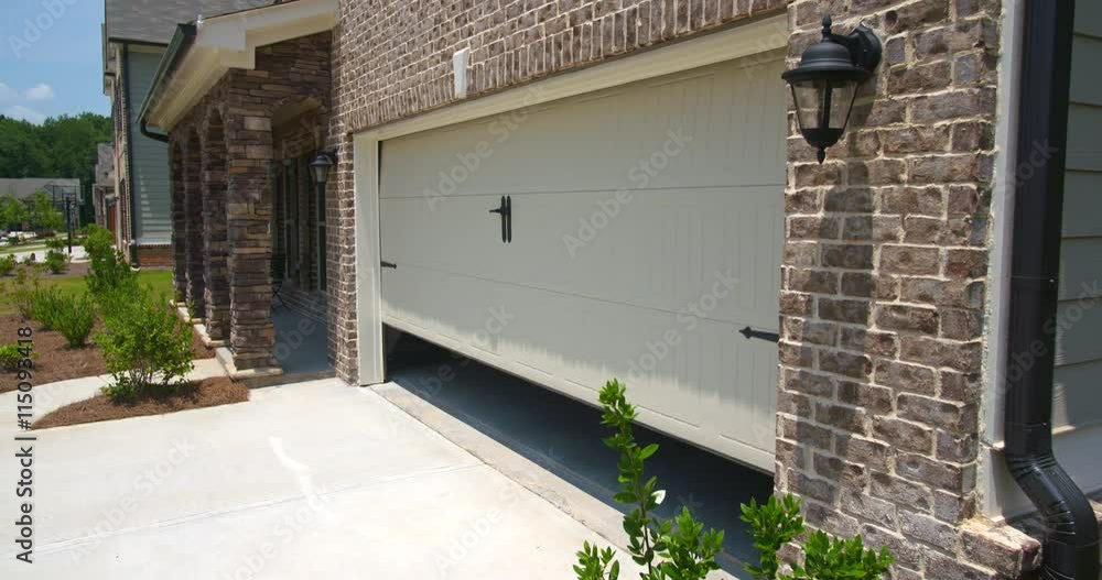 Home Garage Door Opens Angled Lowering. lowering shot on an angled