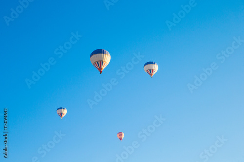  air balloons flying over the valley at Cappadocia