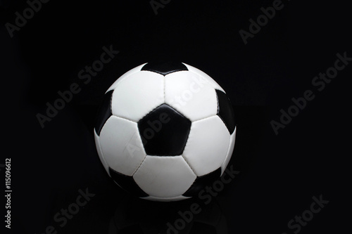 soccer ball on a black background © StockBox