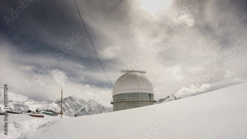 time lapse of the breathtaking view of winter Caucasus mountains with observatory Terskol summit at 3000m in Russia photo