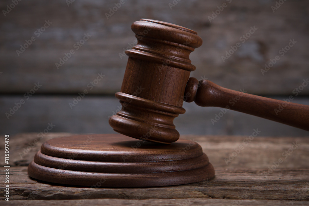 Brown gavel with stand. Gavel on old wooden surface. Freedom is the most precious. Avoid trial at all costs. Brown gavel with stand. Gavel on old wooden surface. Freedom is the most precious. Avoid trial at all costs.