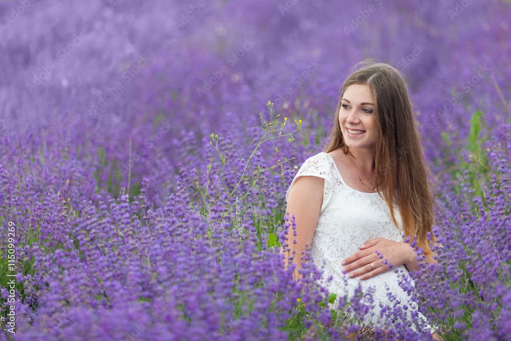Lavender field and a happy pregnant woman Lavender field and a happy pregnant woman