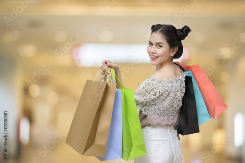 Attractive shopper woman holding shopping bags