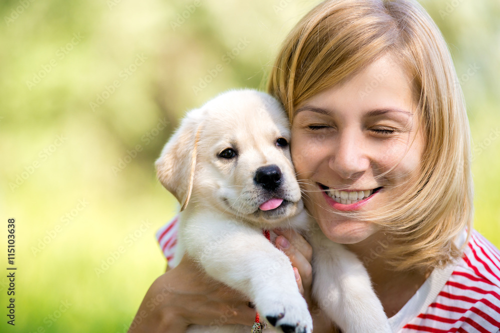 Girl with labrador puppy Girl with labrador puppy