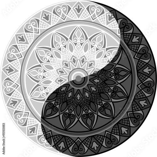 Drawing of a black and white mandala (round ethnic ornament) in shape of symbol yin yang