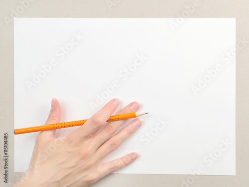 Hand with pencil on blank p...