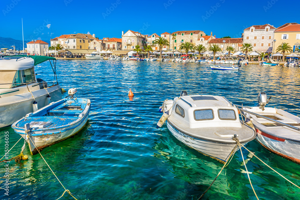 Fototapeta premium Supetar Brac coastline promenade. / Mediterranean promenade of town Supetar, touristic destination on Island of Brac, Croatia, summer time. / Selective focus.