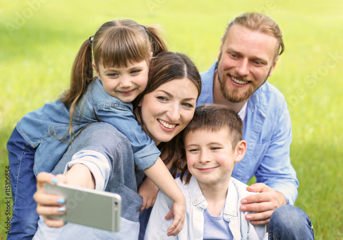 Happy family taking selfie ...