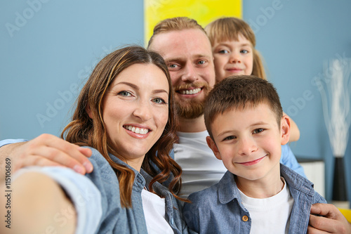 Happy family taking selfie ...