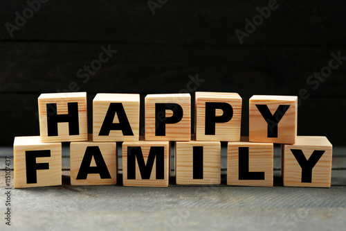 Words HAPPY FAMILY on dark background