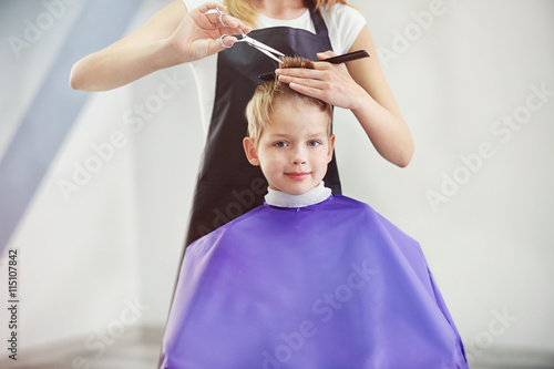 Hairdresser's hands making ...