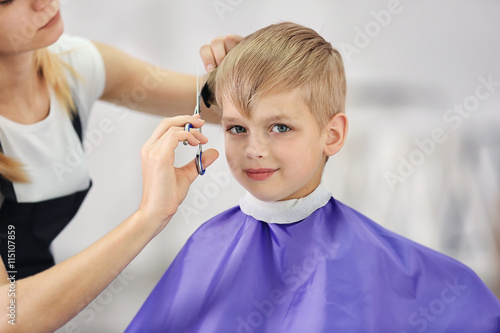 Wallpaper Mural Hairdresser's hands making hairstyle to child Torontodigital.ca