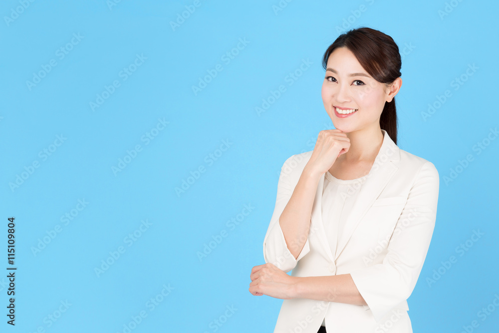 portrait of asian business woman isolated on blue background portrait of asian business woman isolated on blue background