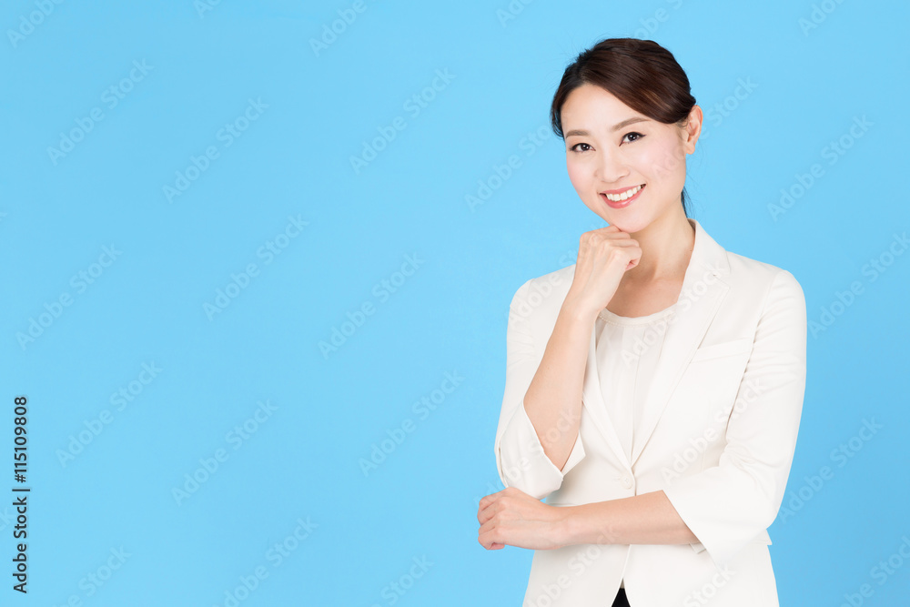 portrait of asian business woman isolated on blue background portrait of asian business woman isolated on blue background