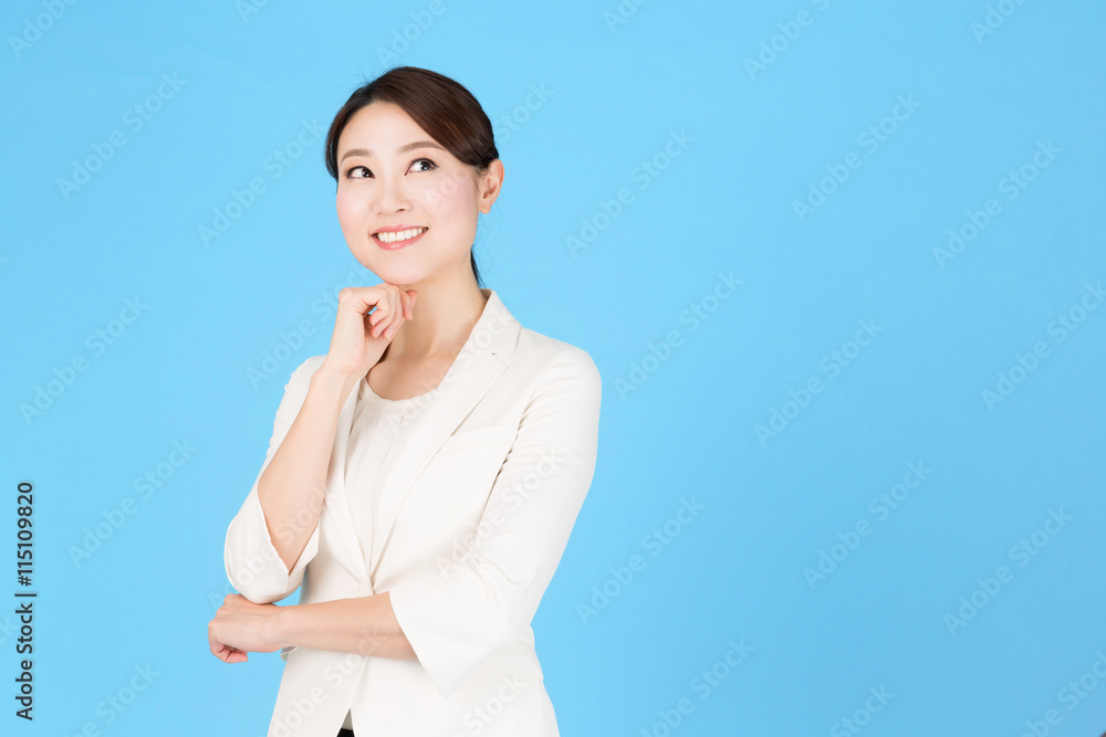 portrait of asian business woman isolated on blue background portrait of asian business woman isolated on blue background