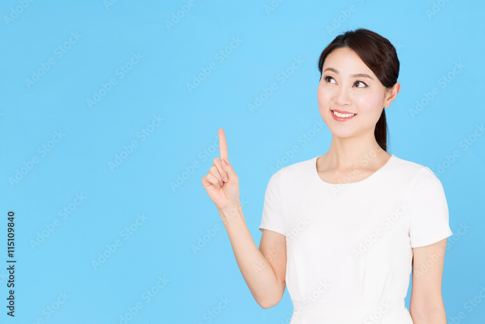 portrait of asian nurse isolated on blue background portrait of asian nurse isolated on blue background