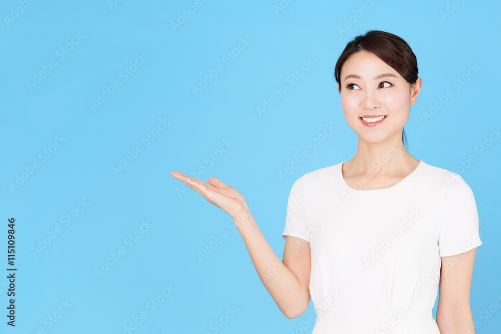 portrait of asian nurse isolated on blue background portrait of asian nurse isolated on blue background