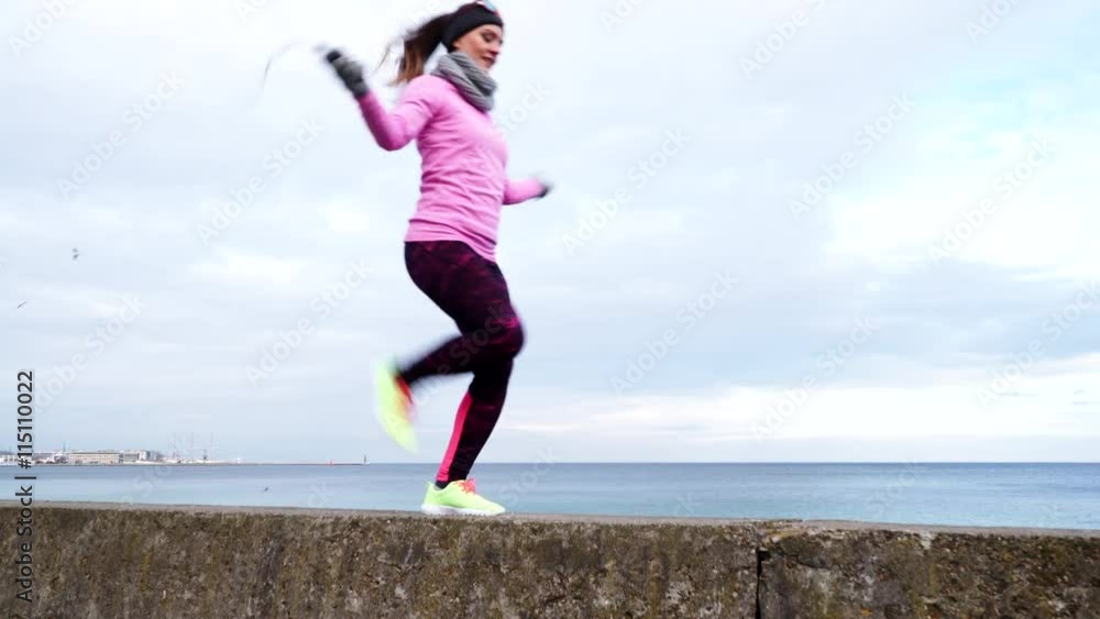 Woman fit sport girl training outdoor with jump rope on cold day 4K Woman fit sport girl training outdoor with jump rope on cold day 4K