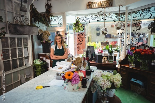 Female florist standing with arms crossed