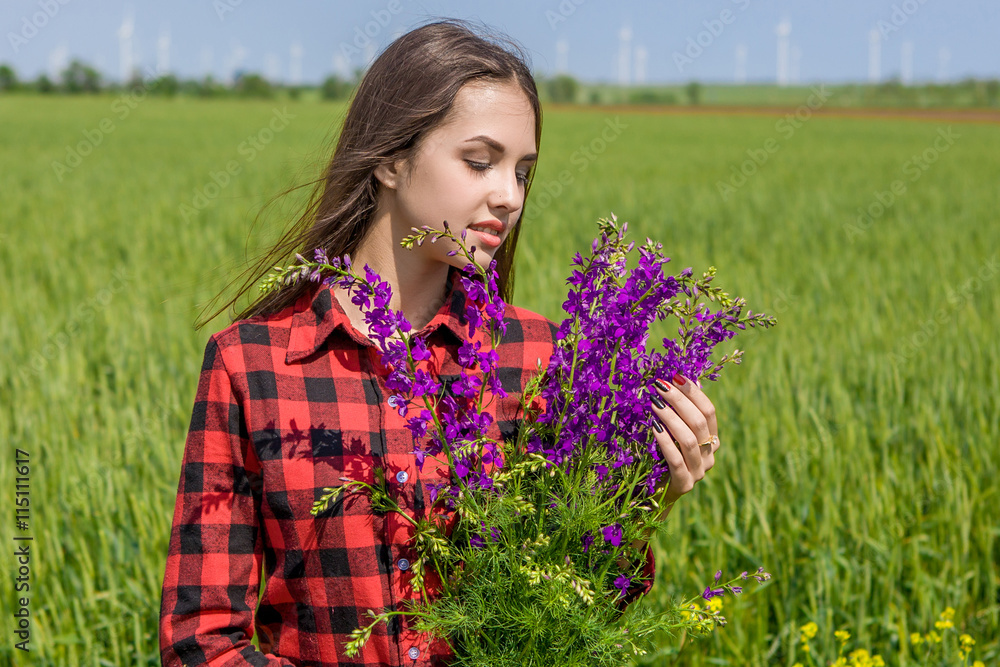 Beautiful girl on field with wildflowers Beautiful girl on field with wildflowers