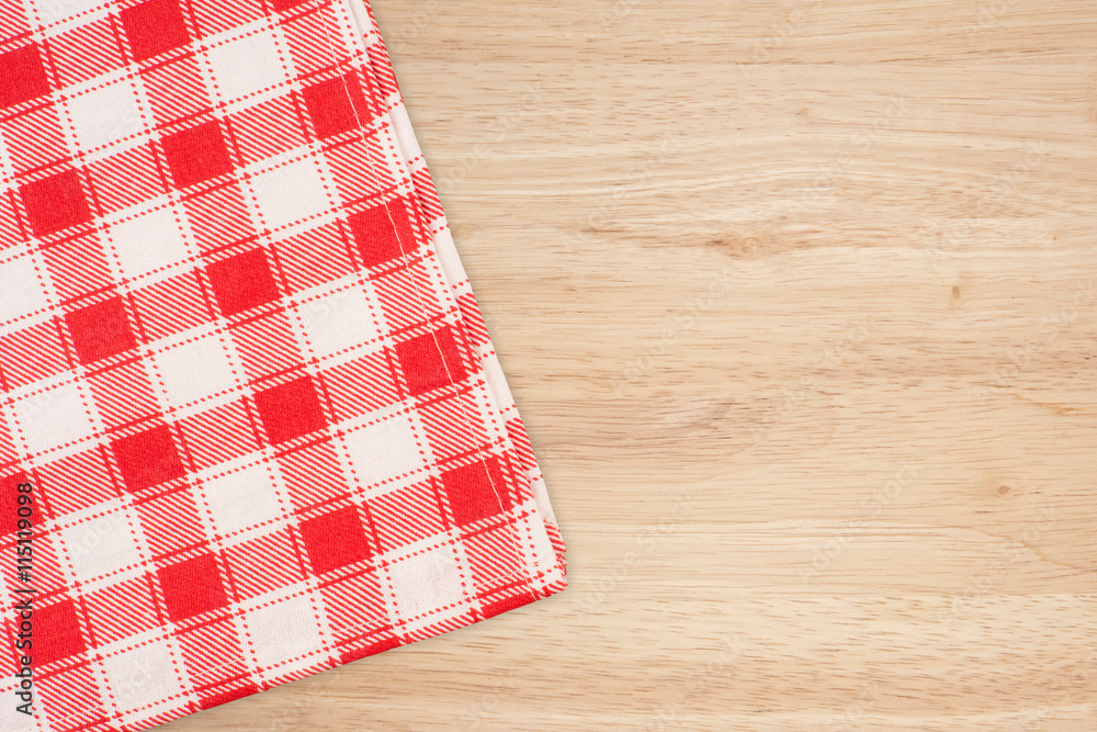 the checkered tablecloth on wooden table