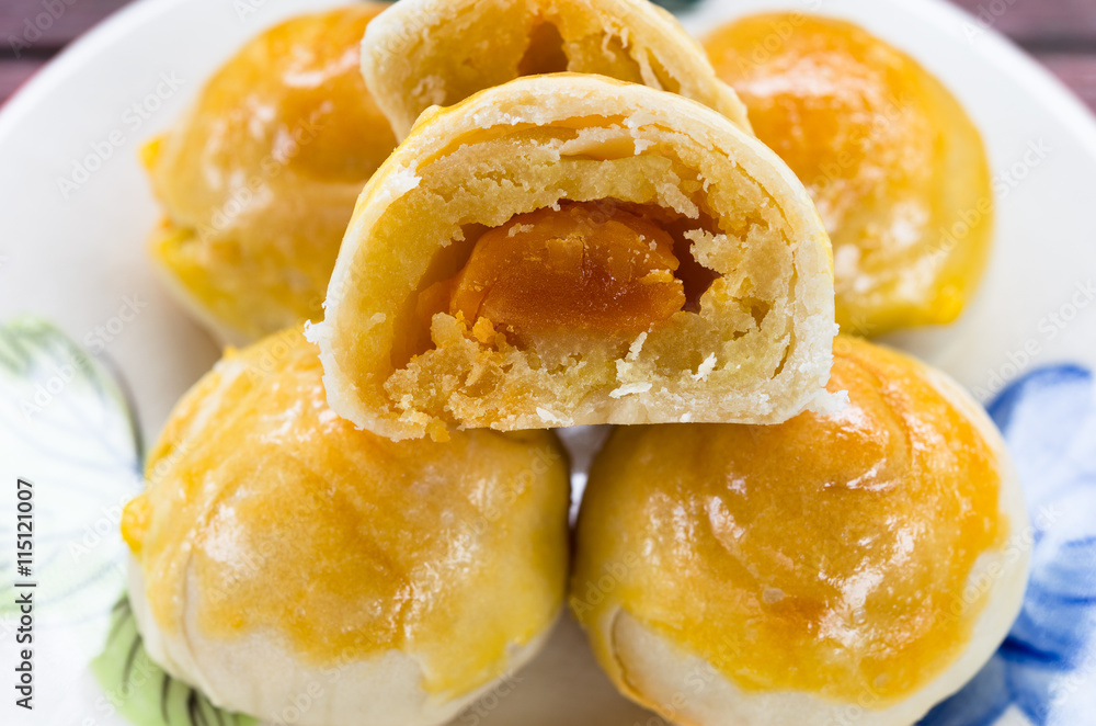 Chinese pastry cake made from flour,bean,egg and sugar on small plate Chinese pastry cake made from flour,bean,egg and sugar on small plate