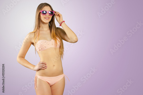Woman in bikini and sunglasses isolated © fotofabrika