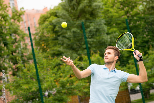 Professional athlete playing tennis on court © Yakobchuk Olena