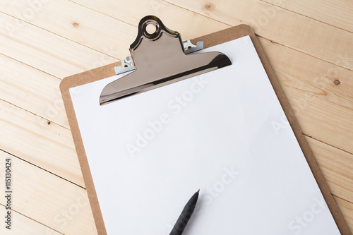 Wooden clipboard on wood background