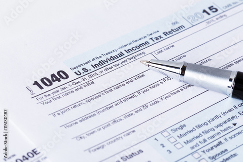 Income tax form and pen