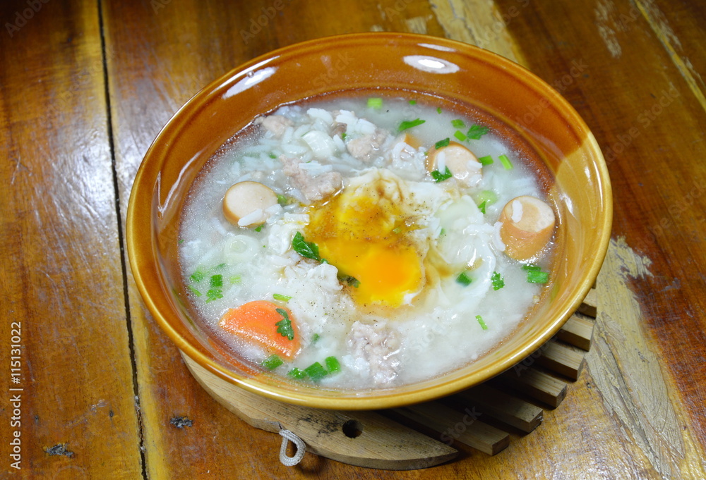 rice porridge with pork sausage topping creamy yolk on bowl rice porridge with pork sausage topping creamy yolk on bowl