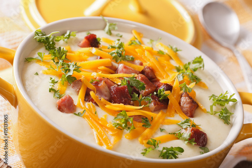 potato soup with bacon and cheese in a pot macro. horizontal
