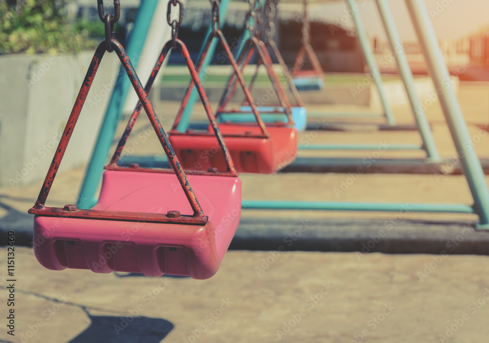 Empty children swing set in playground