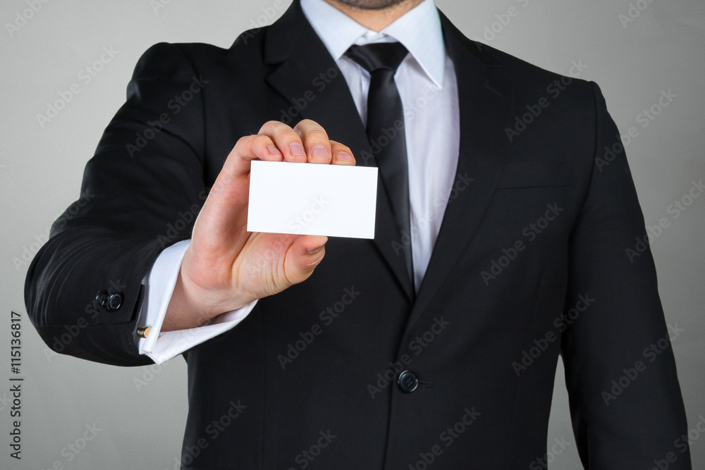 Businessman showing his business card Businessman showing his business card