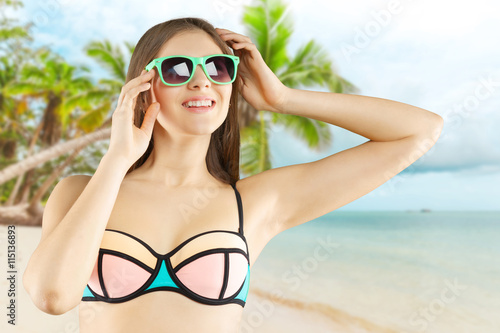 Portrait of a beautiful young woman posing in bikini © fotofabrika