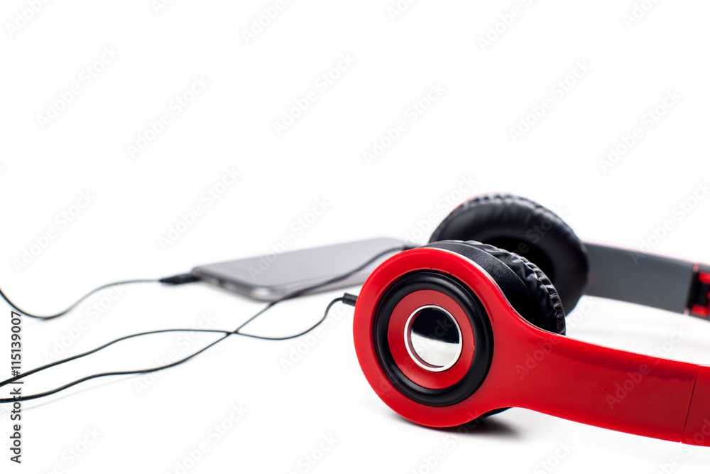 Naklejka premium audio player with headphones isolated on white background