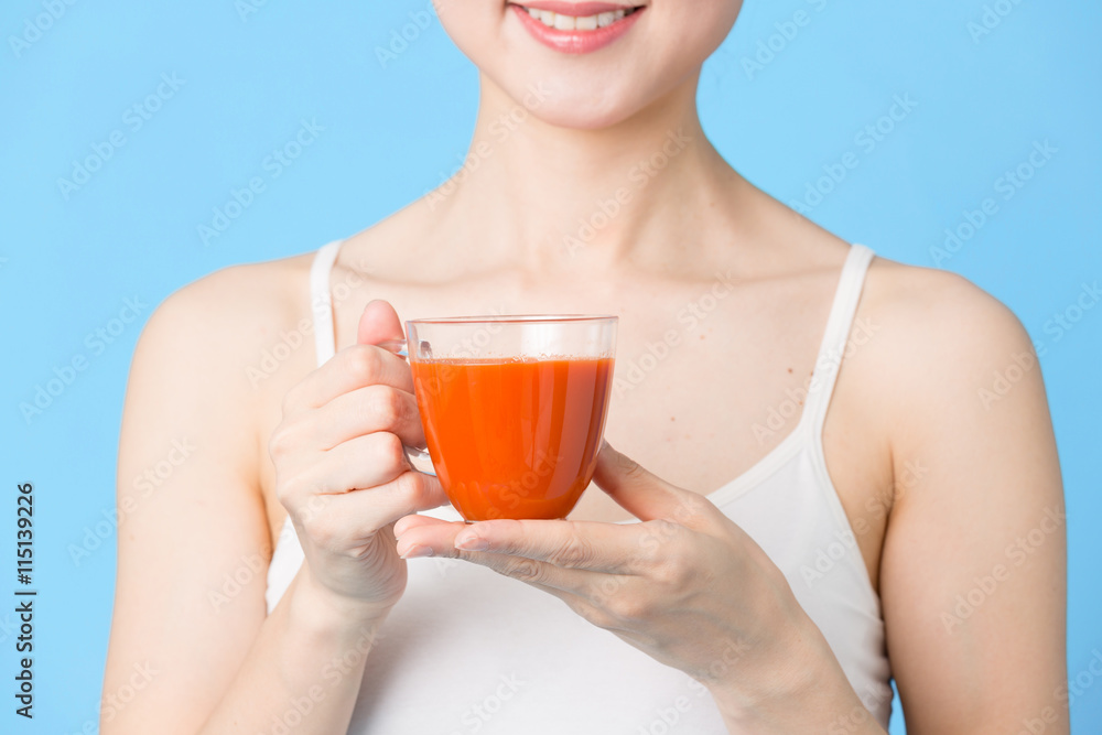 attractive asian woman isolated on blue background attractive asian woman isolated on blue background