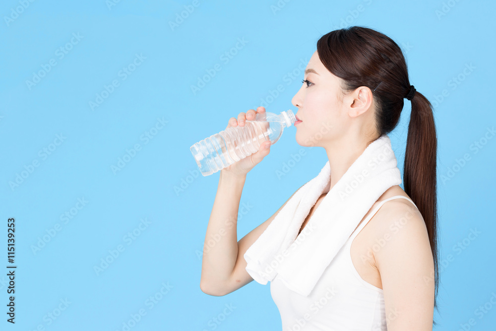 attractive asian woman isolated on blue background attractive asian woman isolated on blue background