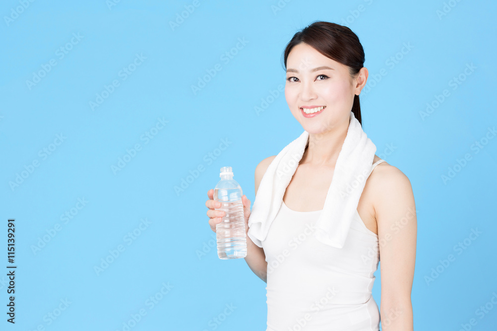attractive asian woman isolated on blue background attractive asian woman isolated on blue background