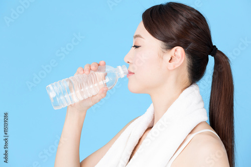 attractive asian woman isolated on blue background